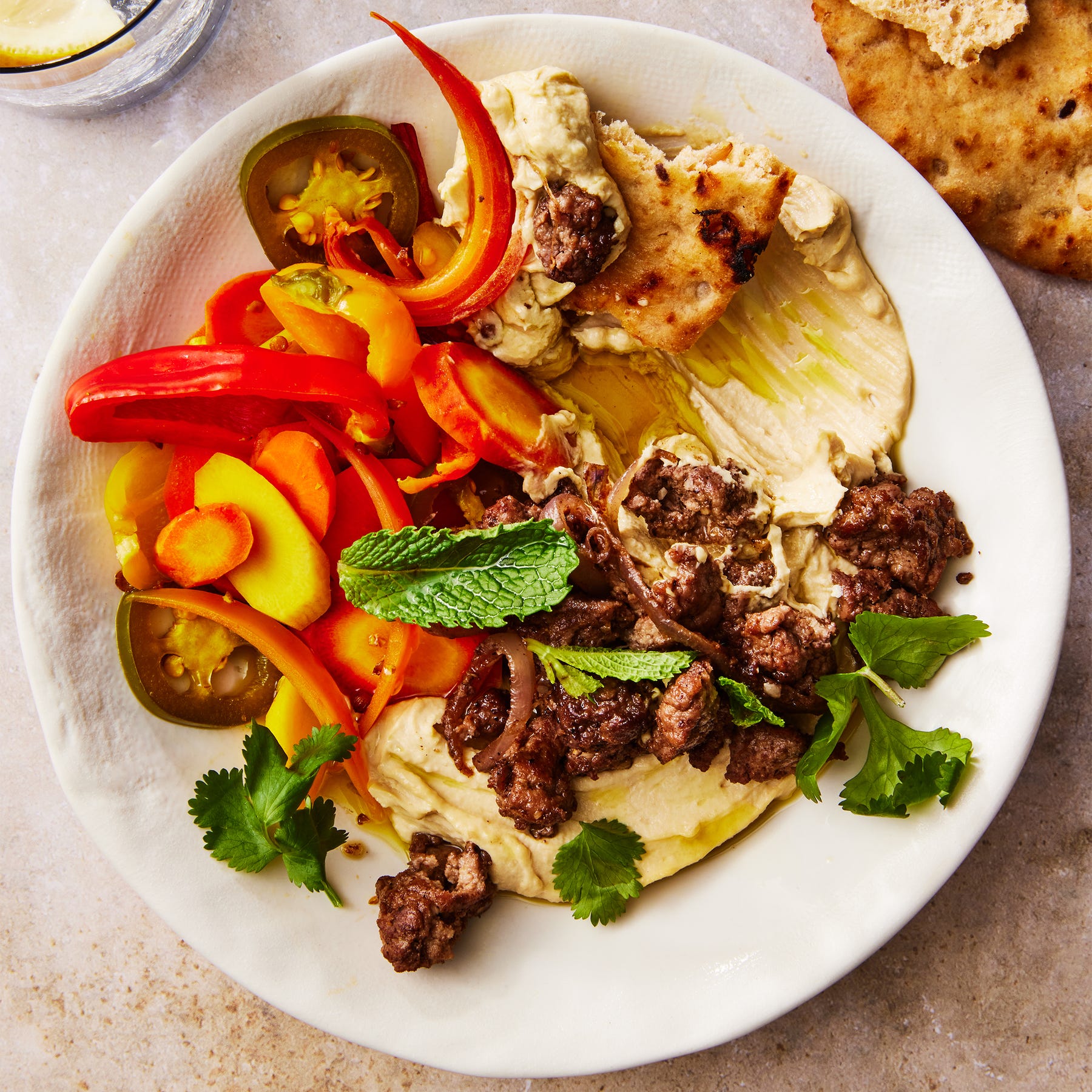 hummus-bowl-with-spiced-lamb-lead-65ba887ba7143 image